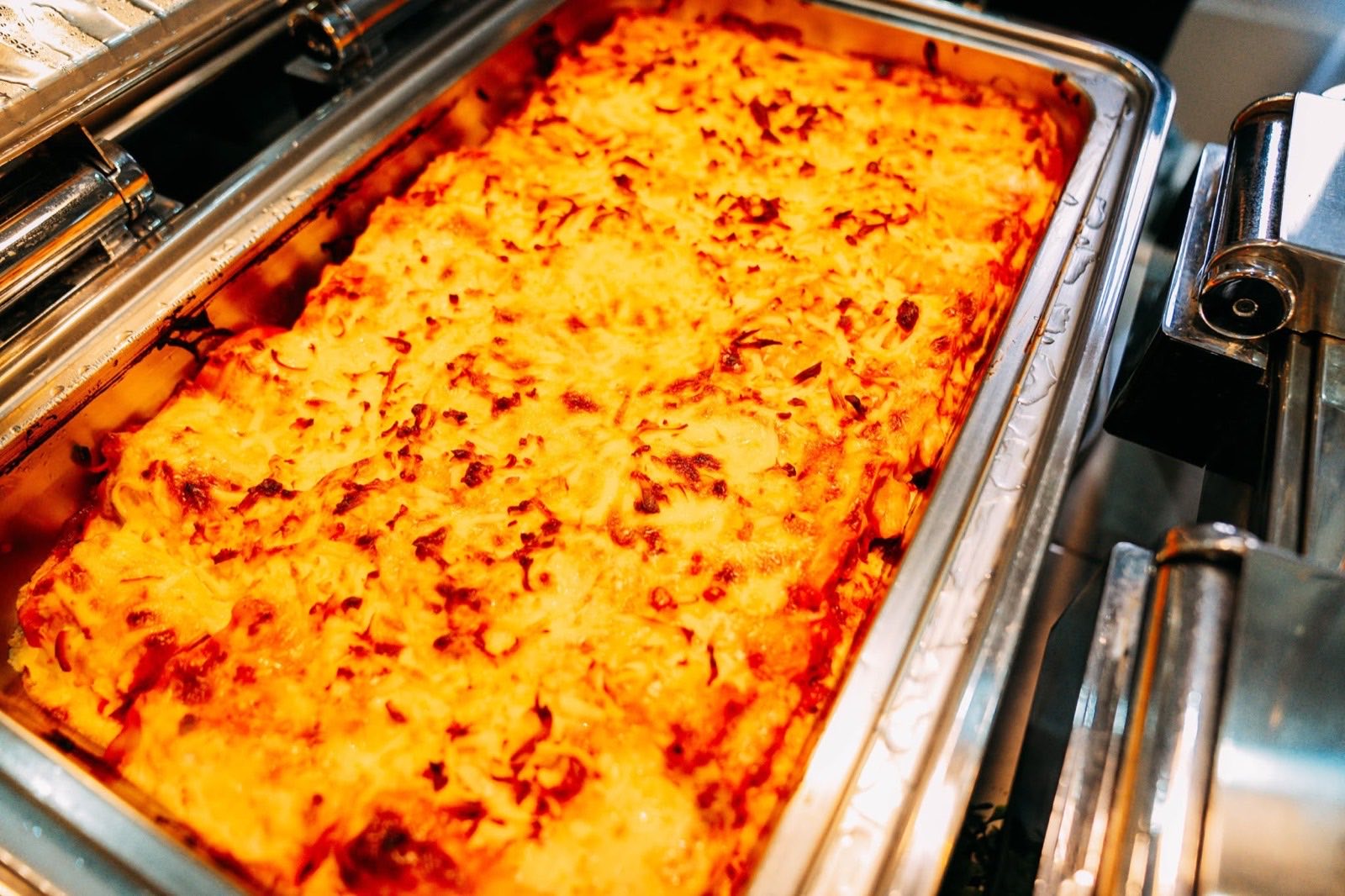 A baked rice dish in a catering tray