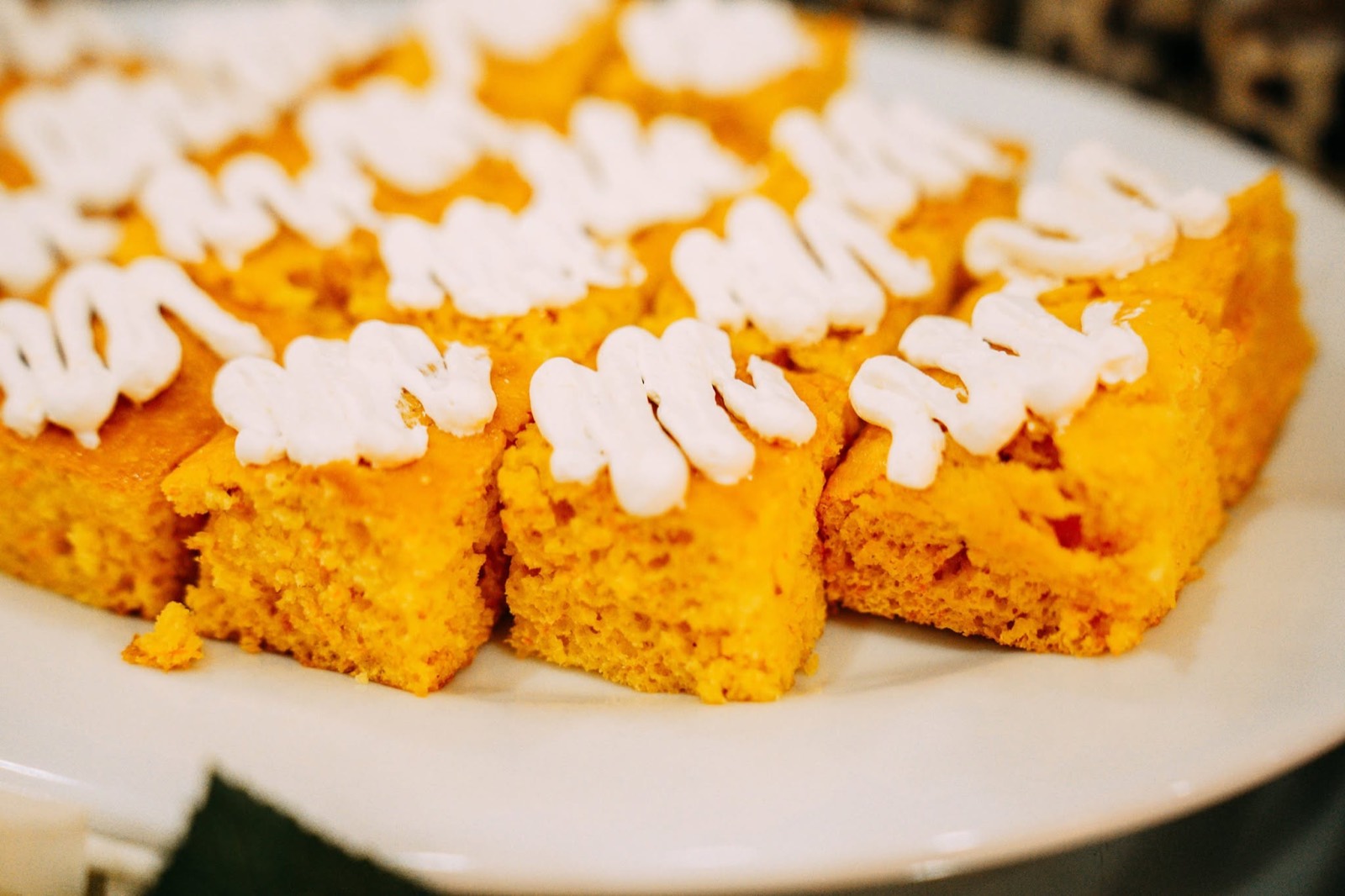Squash dessert bars on a serving plate