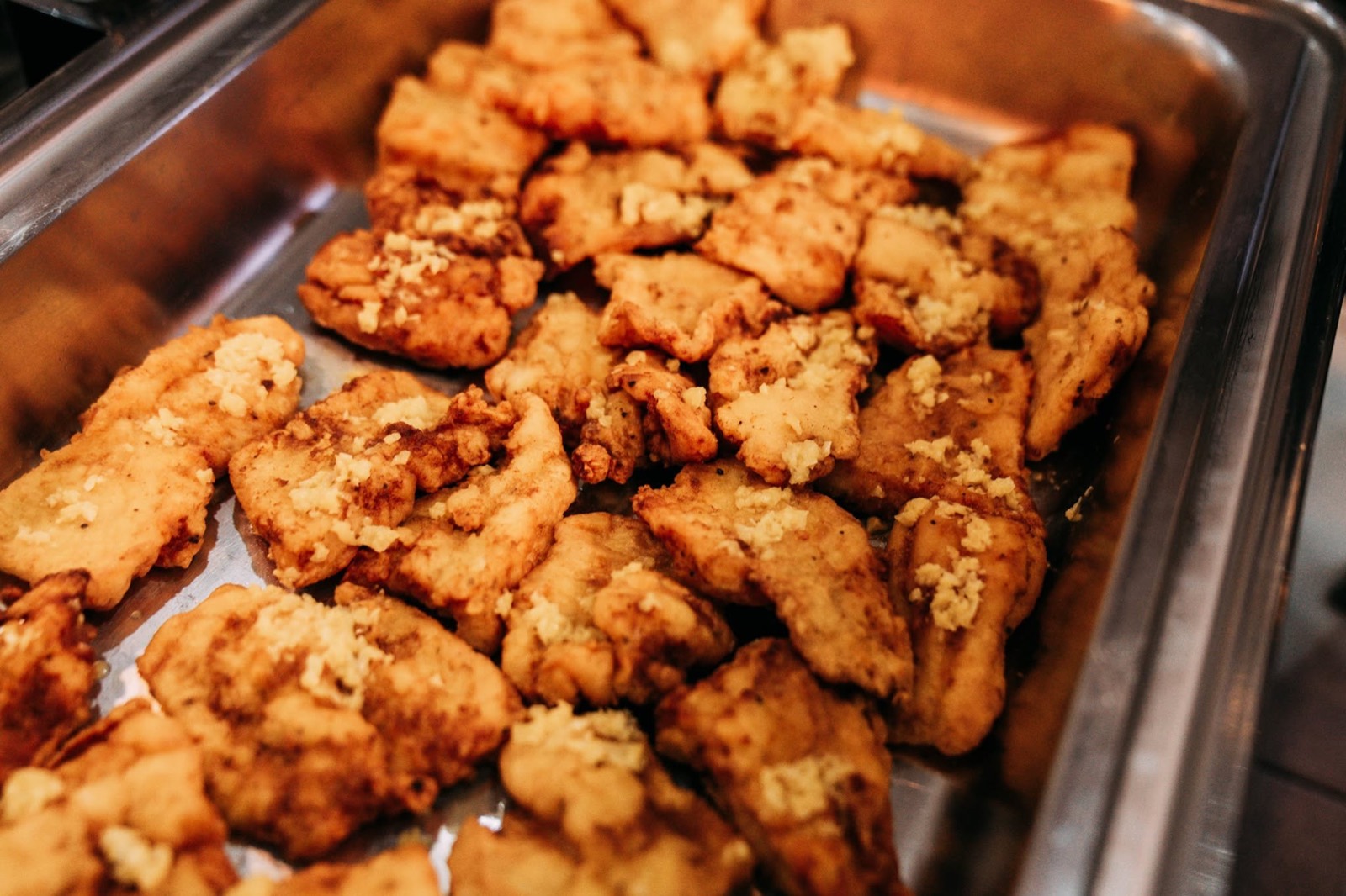 A tray of fried chicken pieces