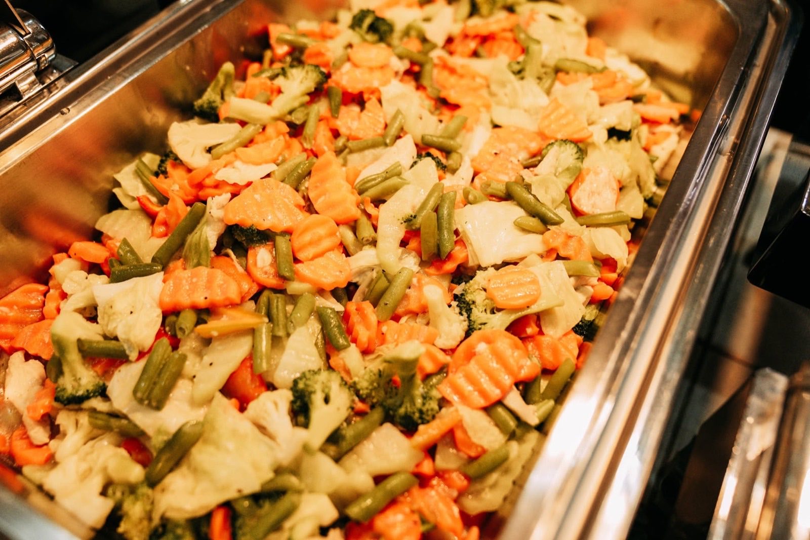 Sauteed mixed vegetables in a catering tray